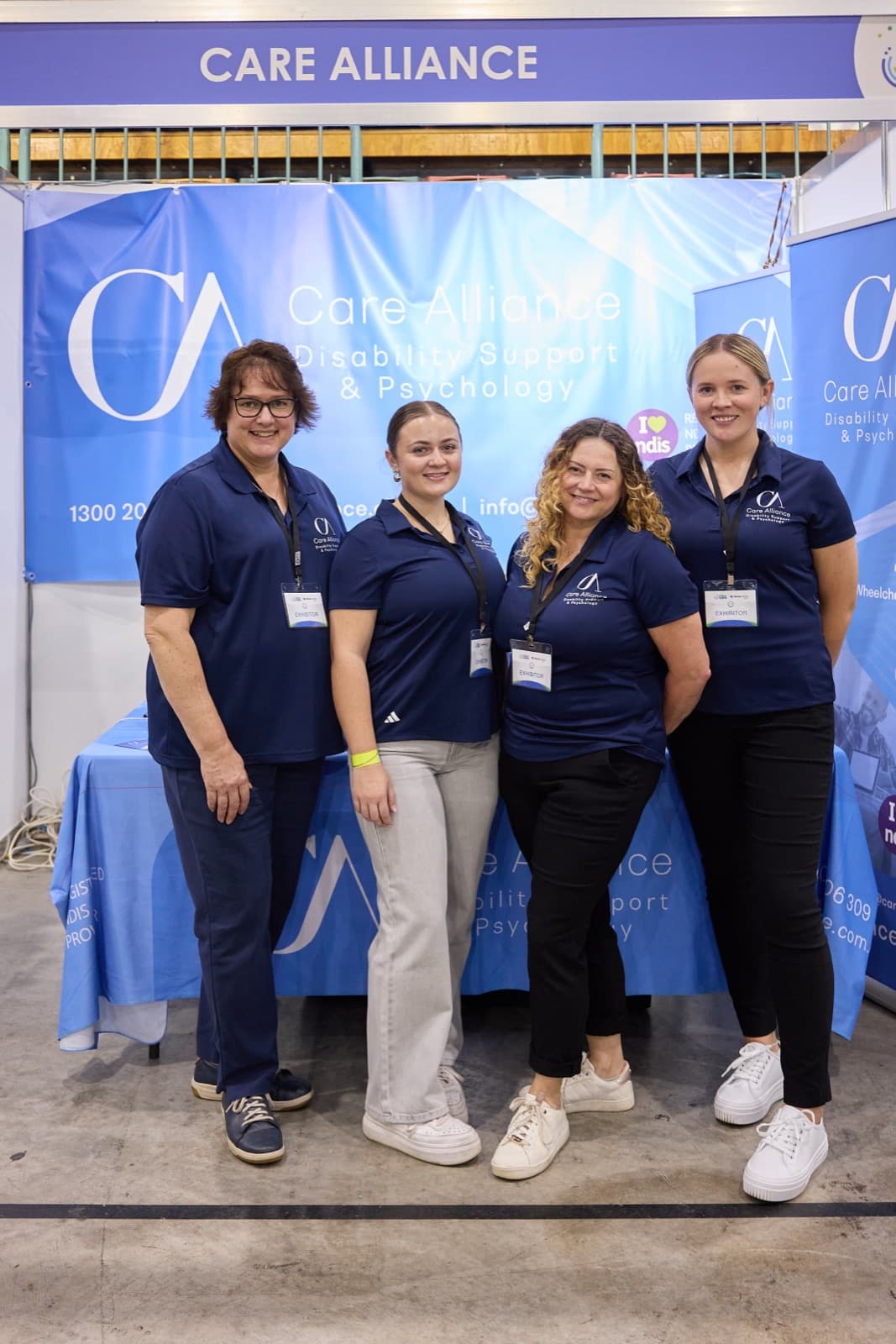 Care Alliance team members at the company stand