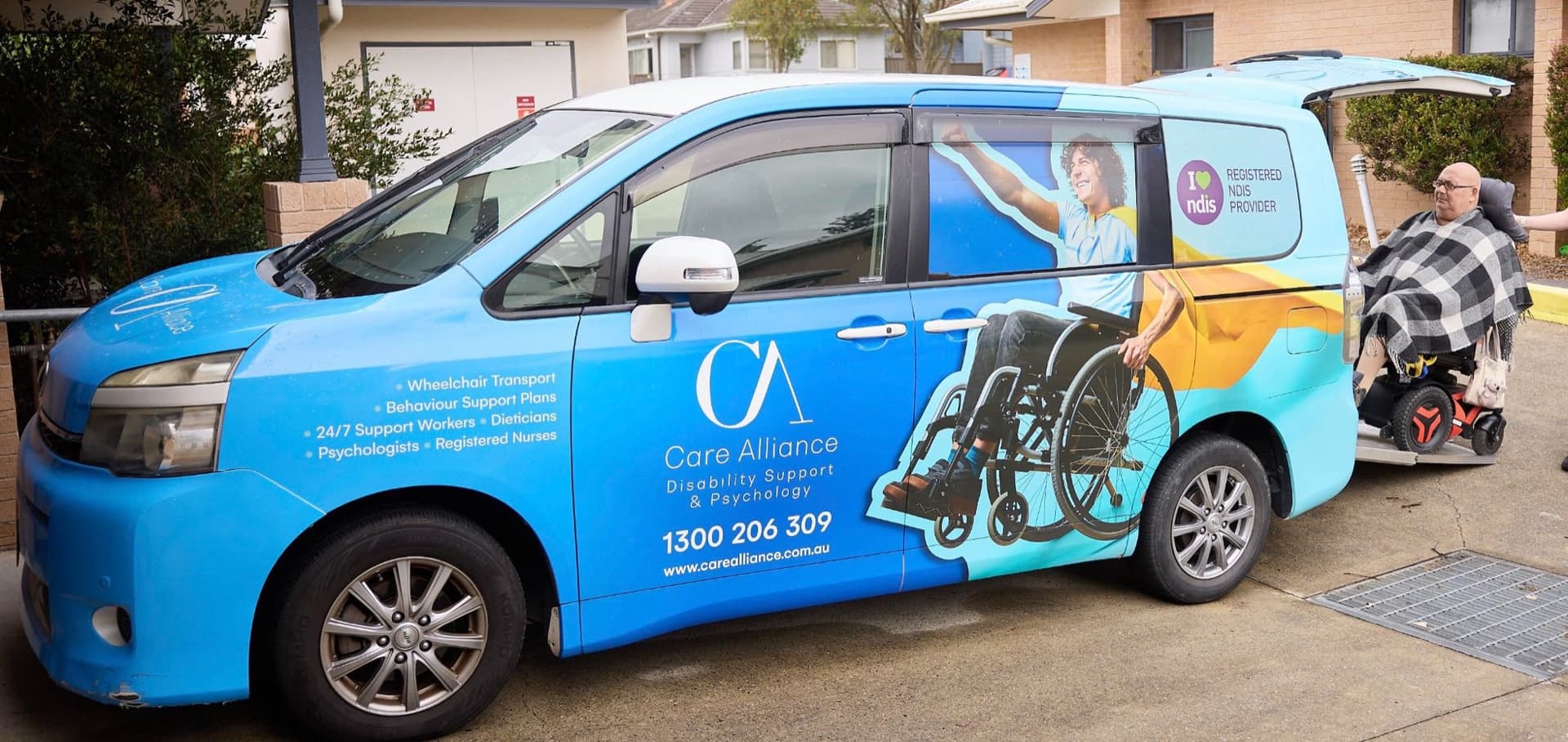 Care Alliance branded wheelchair-accessible van